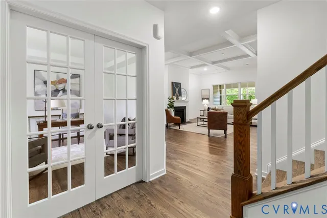 a view of living room with furniture and wooden floor
