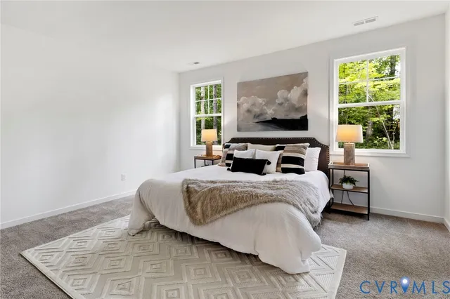 a bedroom with a bed and window