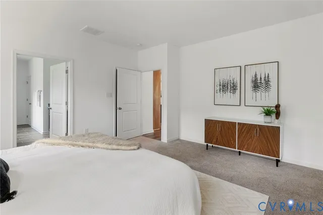 a bedroom with a bed and a cabinets