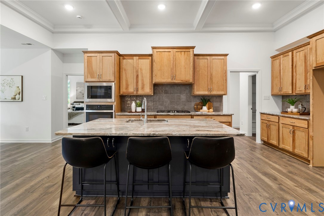 13030 Alsandair Drive Chesterfield, VA 23838 - Photo 8 of 33 Kitchen featuring ornamental molding, an island wi