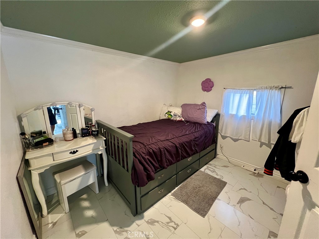 4849 Peck Road, Unit 48 El Monte, CA 91732 - Photo 6 of 11 a bedroom with a bed and wooden floor