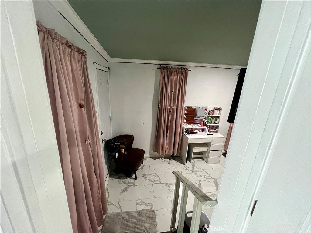 4849 Peck Road, Unit 48 El Monte, CA 91732 - Photo 9 of 11 a view of a hallway and a livingroom with furniture