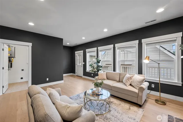 a living room with furniture and a large window
