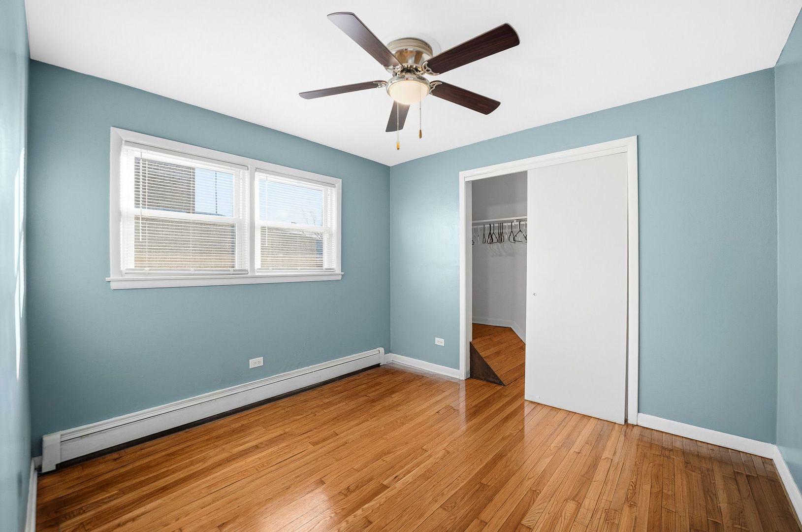 9209 South State Street Chicago, IL 60619 - Photo 6 of 20 a room with window and ceiling fan