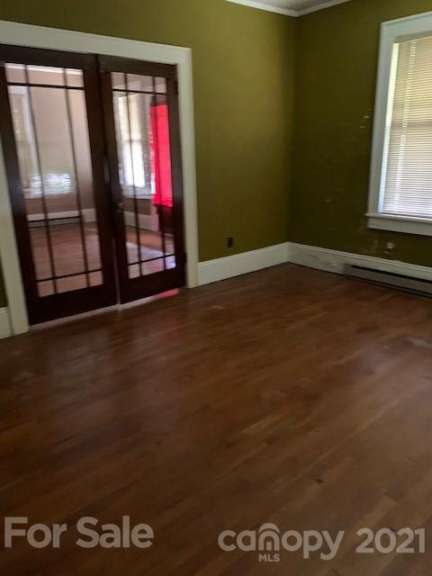 4613-4617 Fallston Road Fallston, NC 28090 - Photo 20 of 21 a view of an empty room with wooden floor and a window