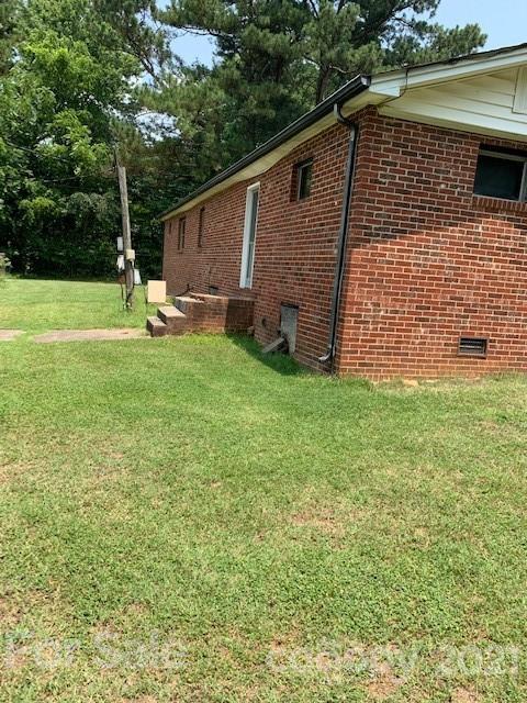 4613-4617 Fallston Road Fallston, NC 28090 - Photo 4 of 21 a backyard of a house with table and chairs