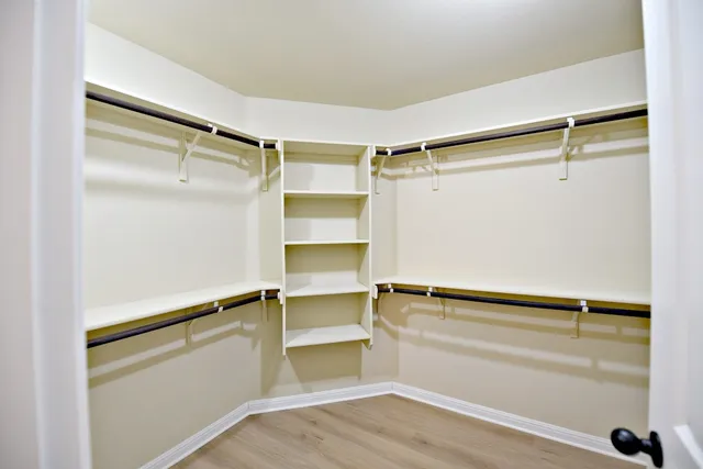 a view of an empty walk in closet