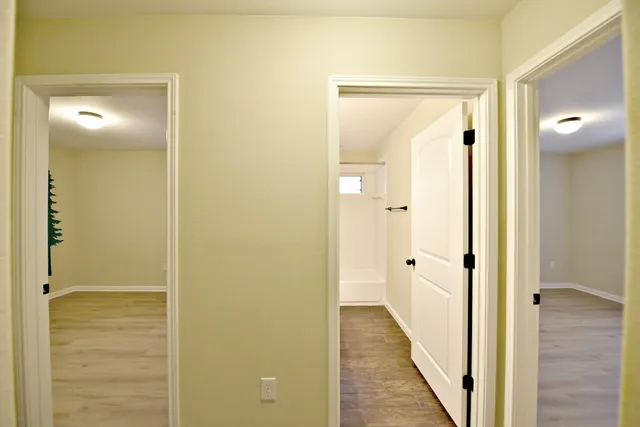 a view of a bathroom from the hallway