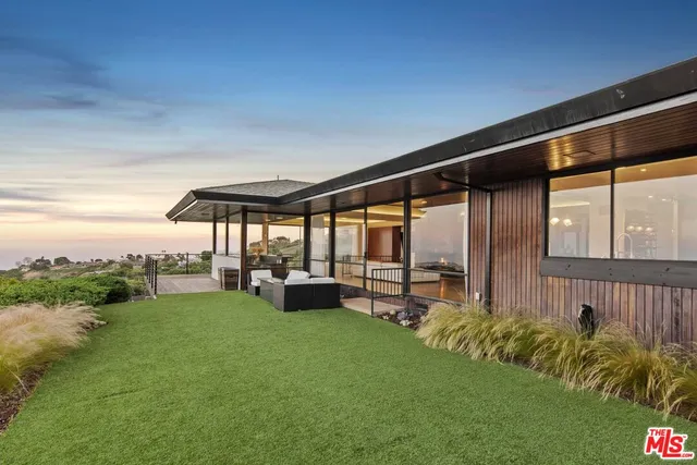 a backyard of a house with lots of green space