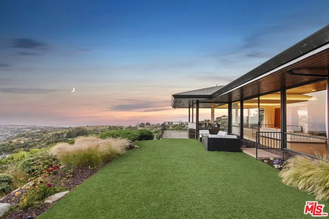 a living room with fireplace furniture and a wooden floor