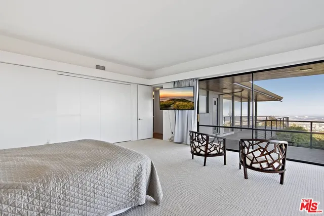 a bathroom with a double vanity sink mirror and tub
