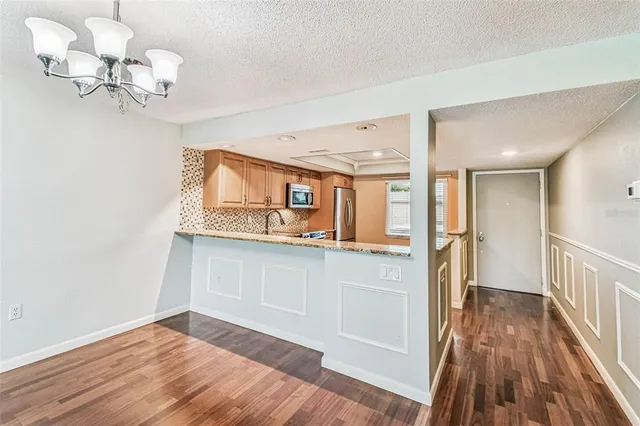 a view of a kitchen with a sink and cabinet