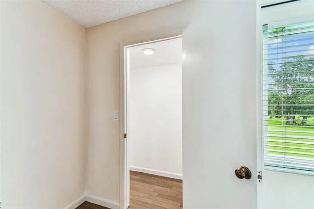 a bathroom with a granite countertop sink a mirror and a shower