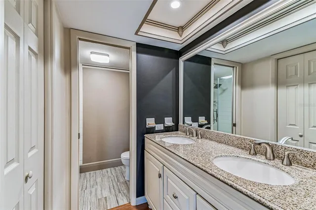 a view of a room with wooden floor and windows