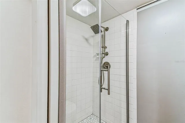 an empty room with wooden floor and a window