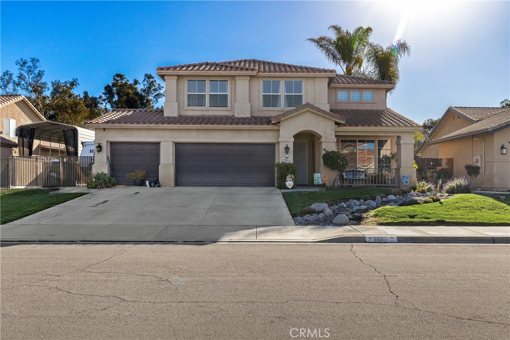 26116 Corte Tecolote Hemet, CA 92544 - Photo 1 of 1 a front view of a house with a yard and potted plants