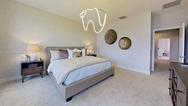 a bedroom with a bed and a table in it