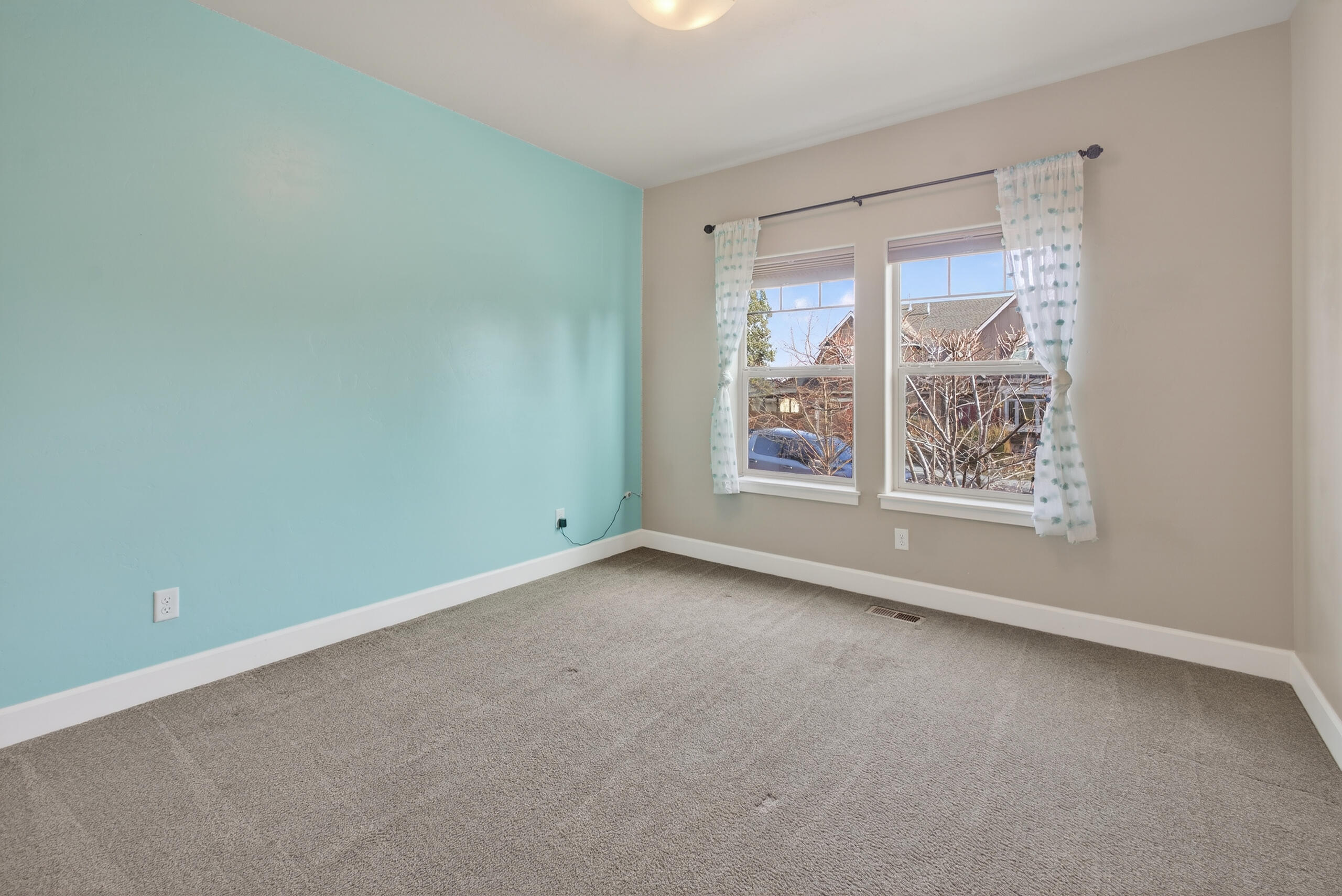 2793 Southwest 33rd Street Redmond, OR 97756 - Photo 23 of 44 an empty room with windows and city view