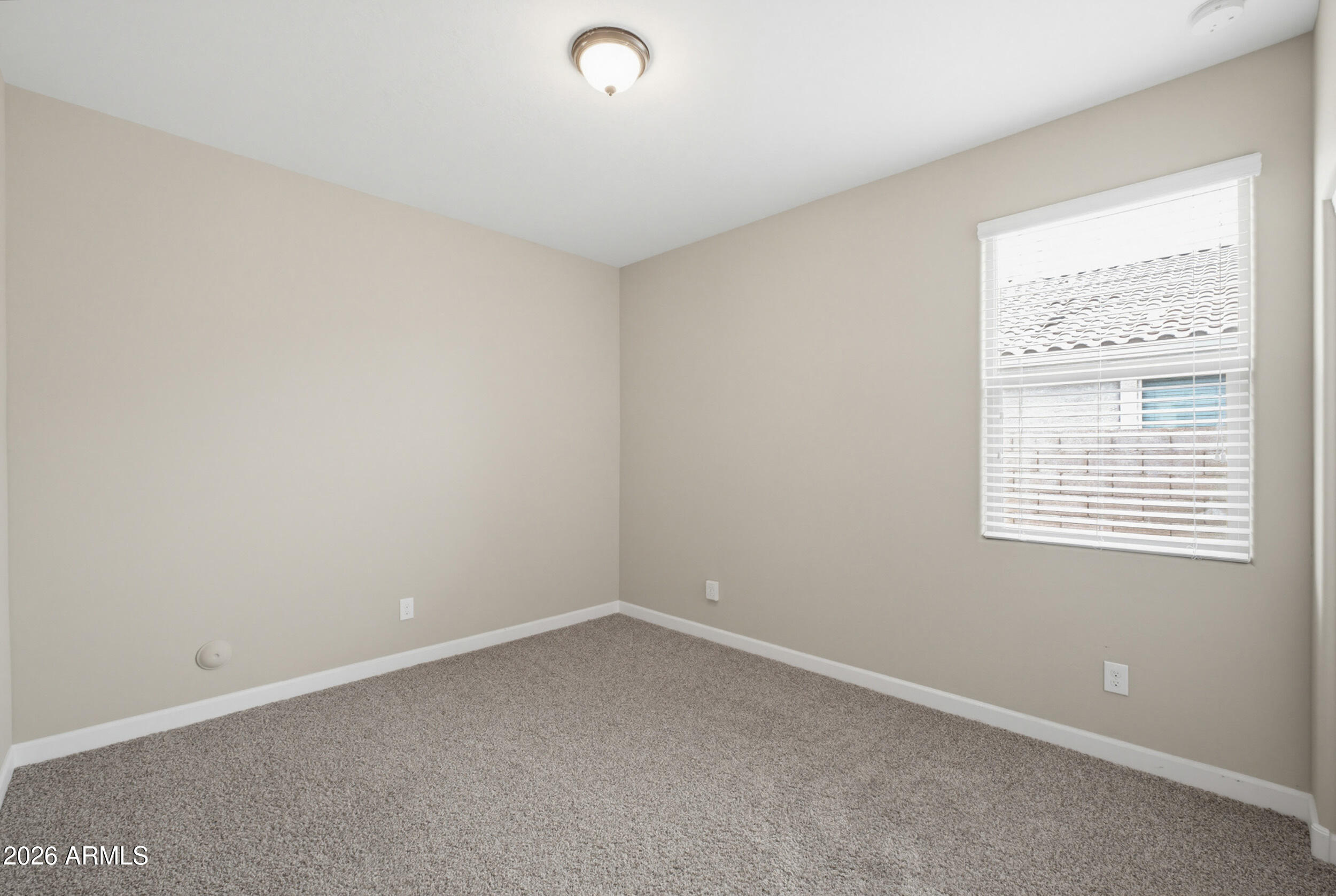 19995 North Ben Court Maricopa, AZ 85138 - Photo 34 of 51 an empty room with a window