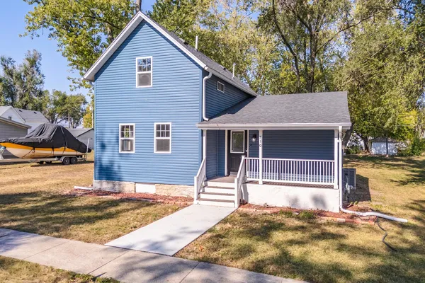 a house with trees in the background