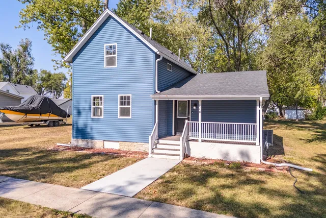 a house with trees in the background