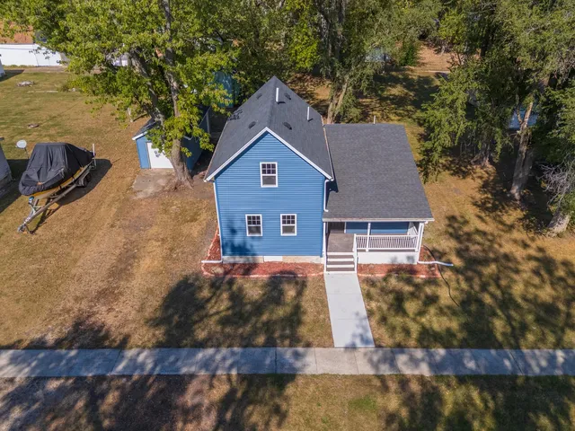 a front view of a house with yard