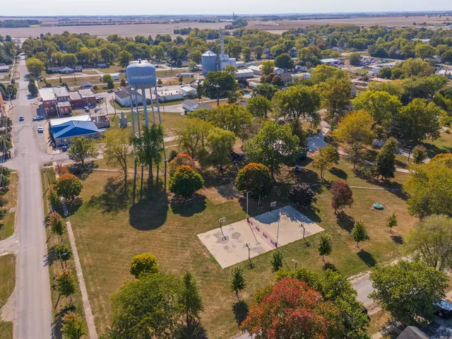 an aerial view of residential houses with outdoor space