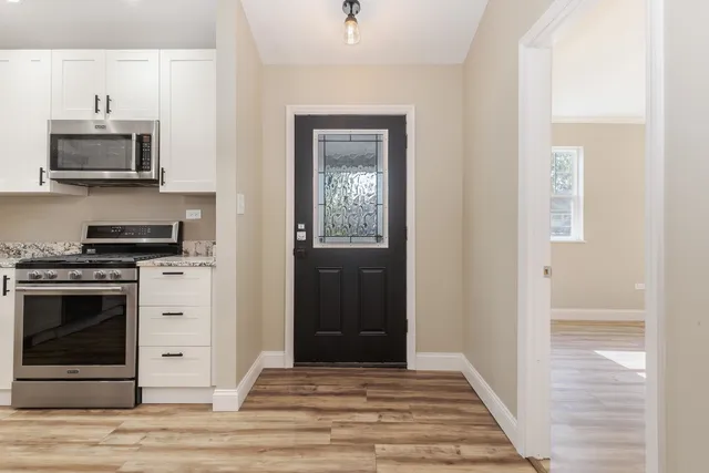 a kitchen with a stove and a microwave