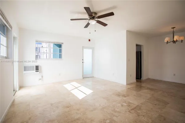 a view of an empty room with a window