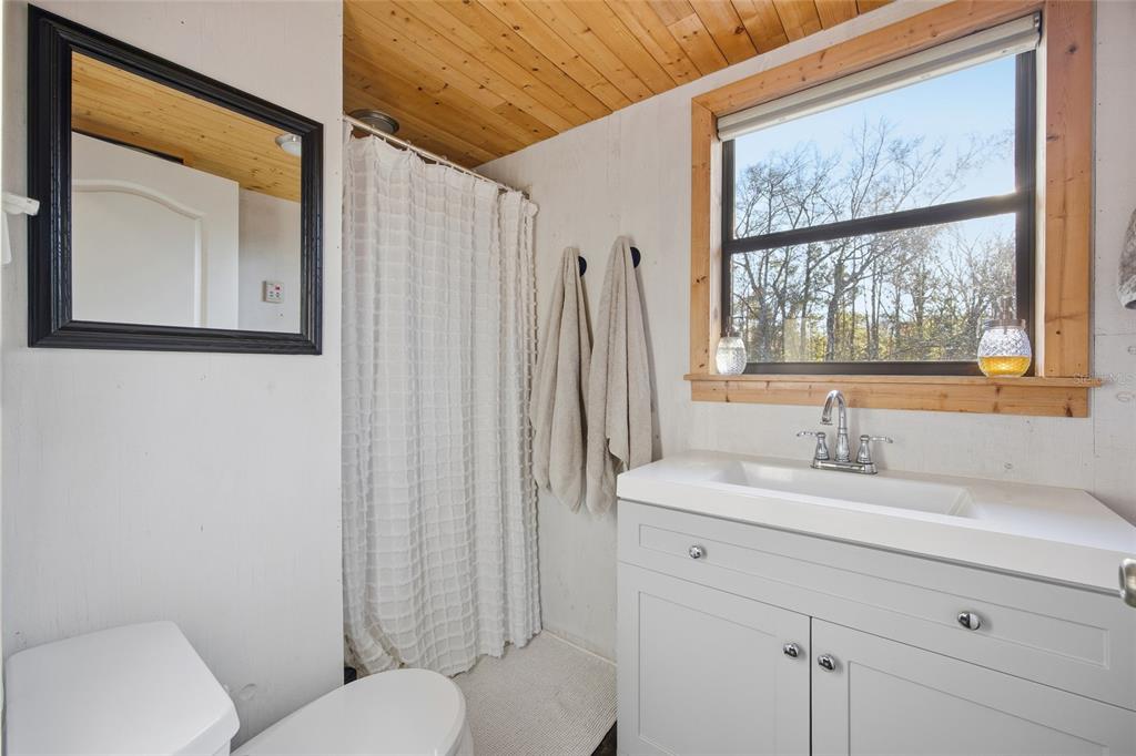 0 Clayton Road Cedar Key, FL 32625 - Photo 11 of 22 a bathroom with a sink toilet and shower