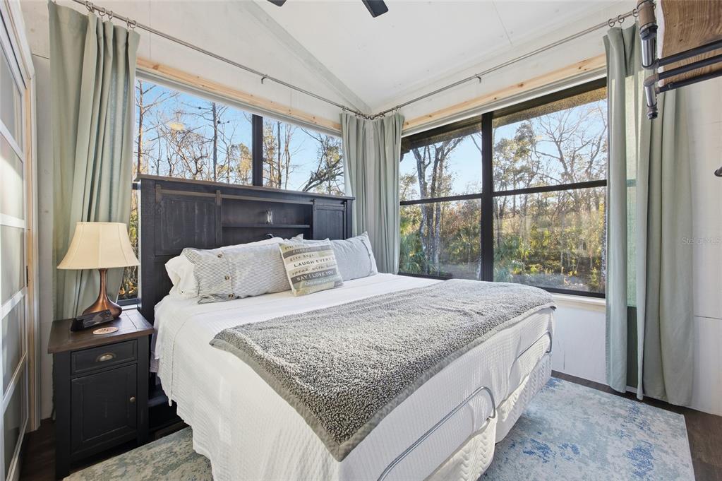 0 Clayton Road Cedar Key, FL 32625 - Photo 12 of 22 a bedroom with a large bed and a window