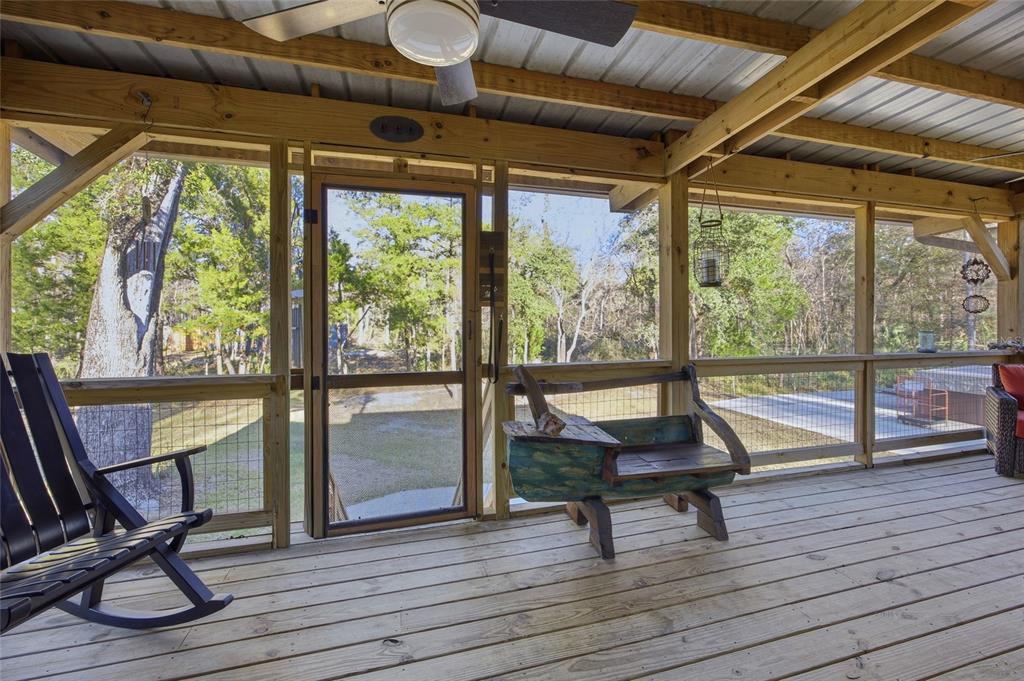 0 Clayton Road Cedar Key, FL 32625 - Photo 4 of 22 a living room with a floor to ceiling window and wooden floor