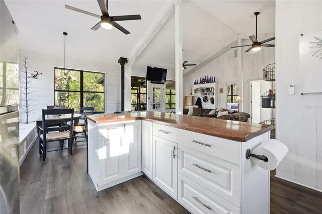 a very nice looking living room with wooden floor and furniture