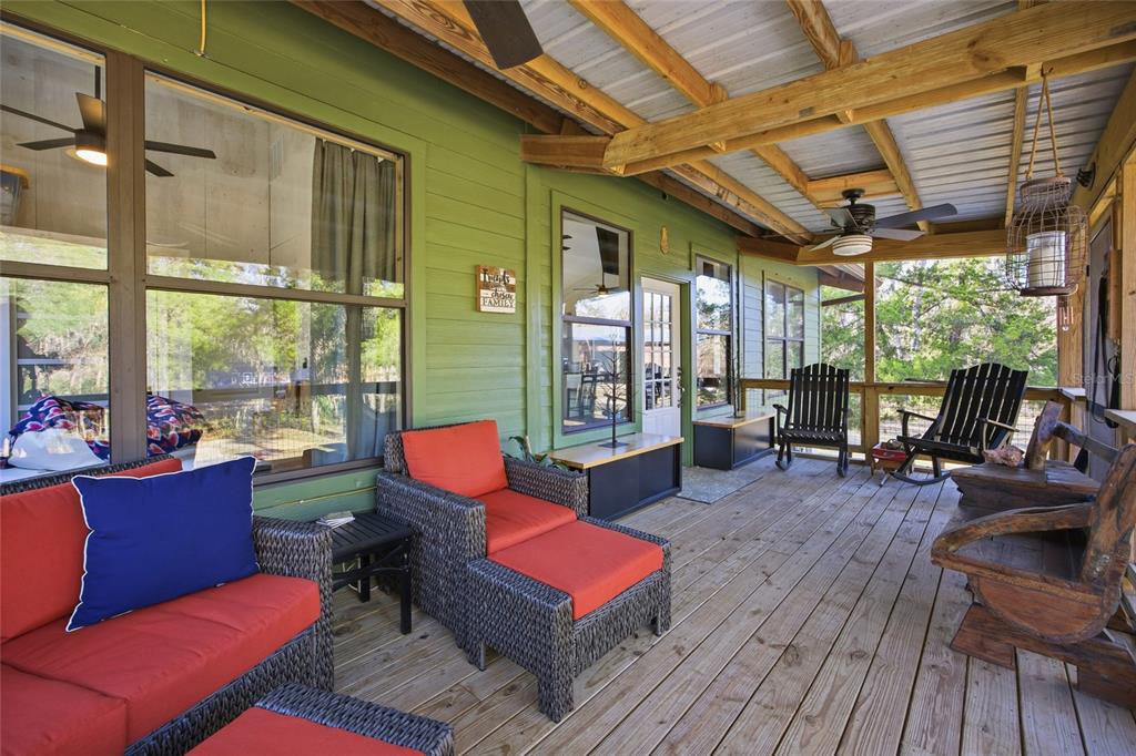 0 Clayton Road Cedar Key, FL 32625 - Photo 5 of 22 a living room with furniture a wooden floor and a large window