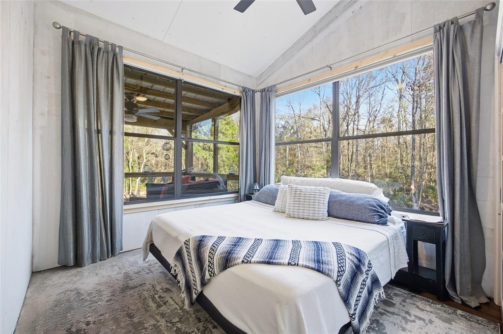 0 Clayton Road Cedar Key, FL 32625 - Photo 6 of 19 a bedroom with a bed and a large window