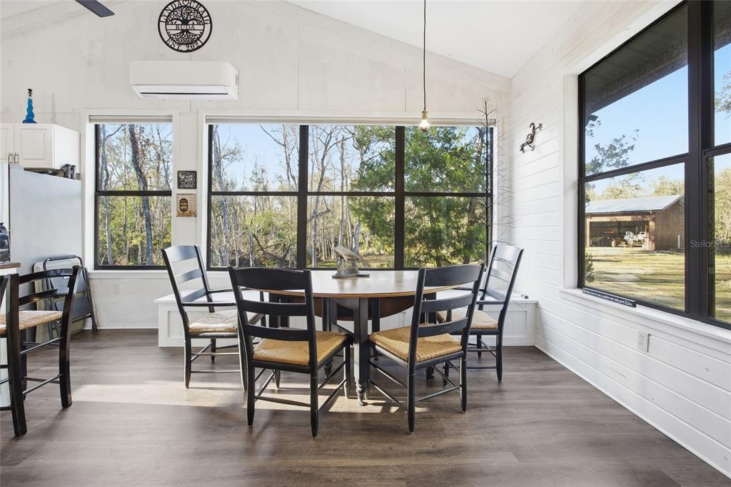 0 Clayton Road Cedar Key, FL 32625 - Photo 7 of 22 a view of a dining room with furniture window and wooden floor
