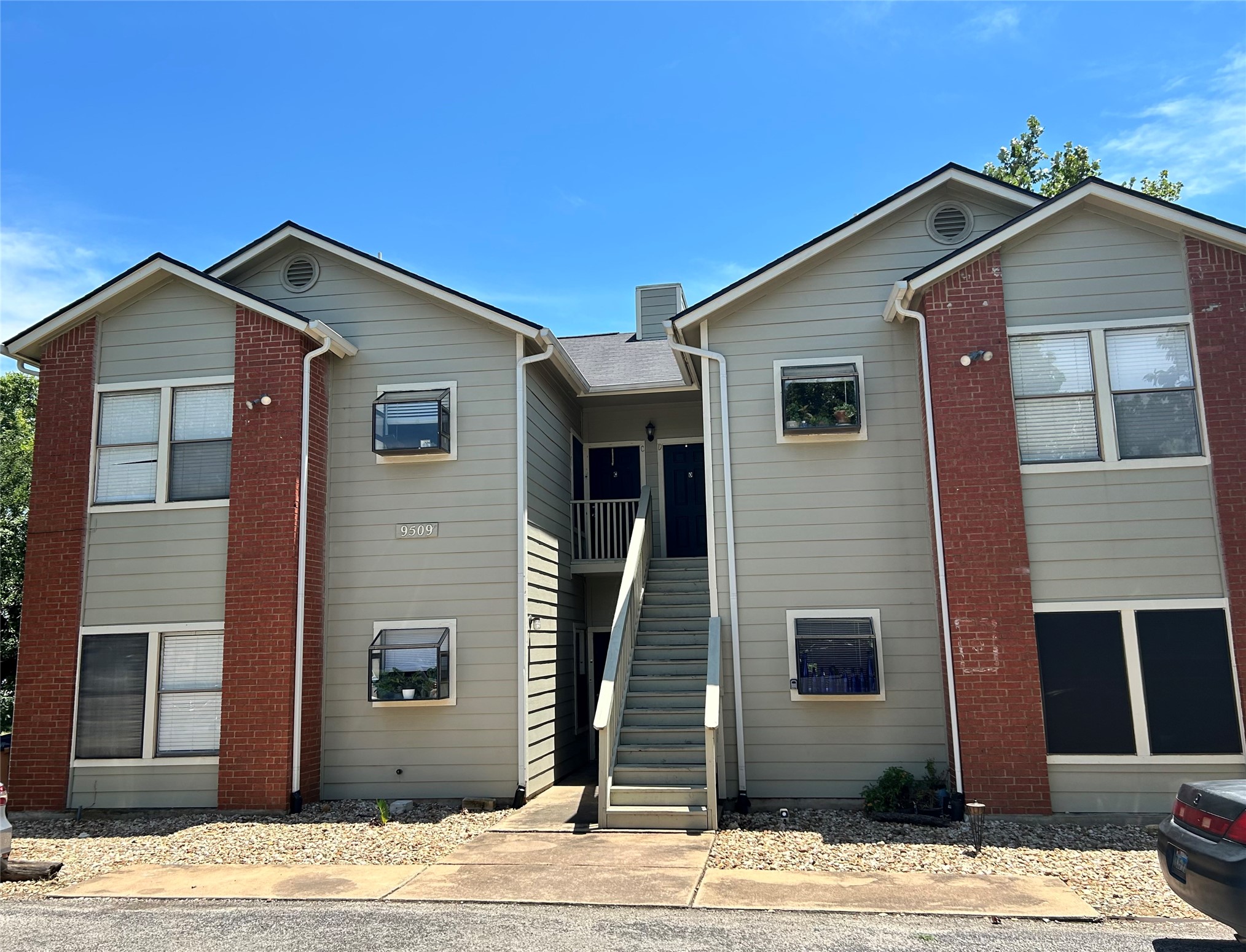 9509 Kempler Drive Austin, TX 78748 - Photo 1 of 12 a front view of a house with a wooden house