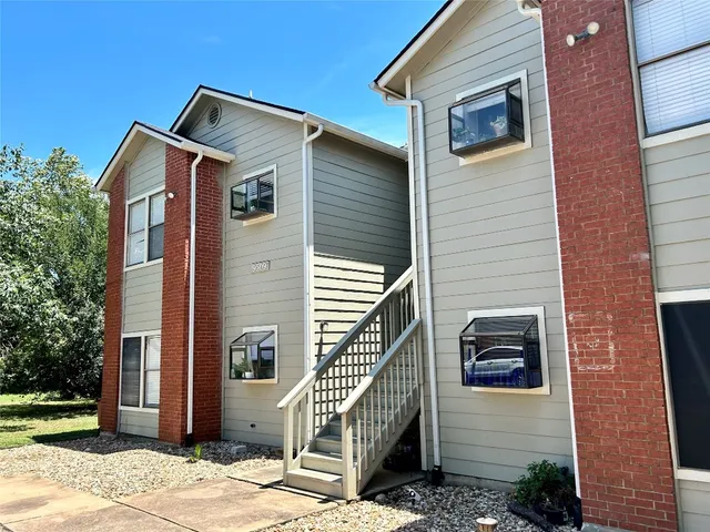 a front view of a house with stairs