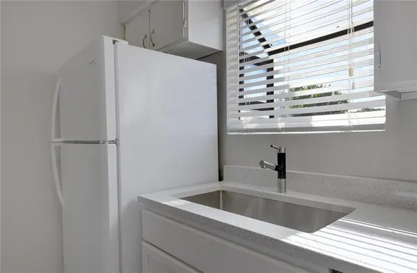 a view of a refrigerator in a kitchen