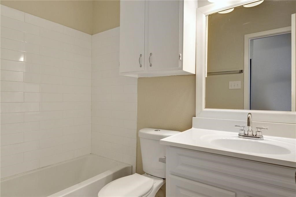 9509 Kempler Drive Austin, TX 78748 - Photo 8 of 12 a bathroom with a sink a toilet and shower