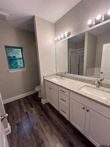 a bathroom with a bathtub and shower