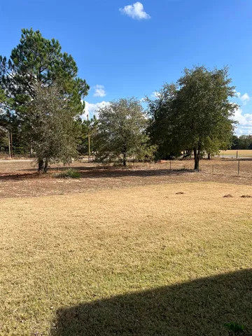 a front view of a house with ocean
