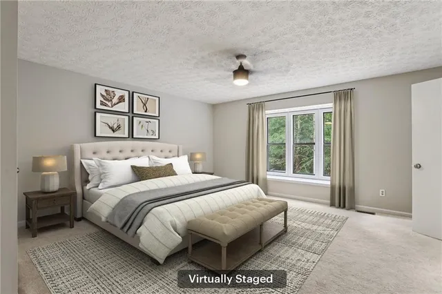 a spacious bedroom with a large bed and a window