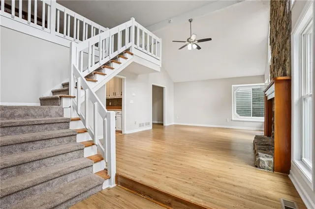 a view of entryway and hall with wooden floor