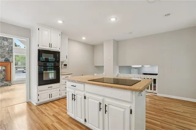 a kitchen that has a sink and a stove in it