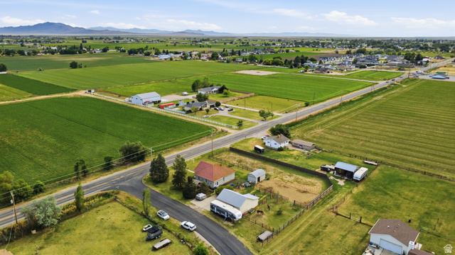 5264 West 5500th Street South Hooper, UT 84315 - Photo 37 of 38 Expansive rural landscape featuring agricultural fields and scattered residential properties, bordered by paved roads