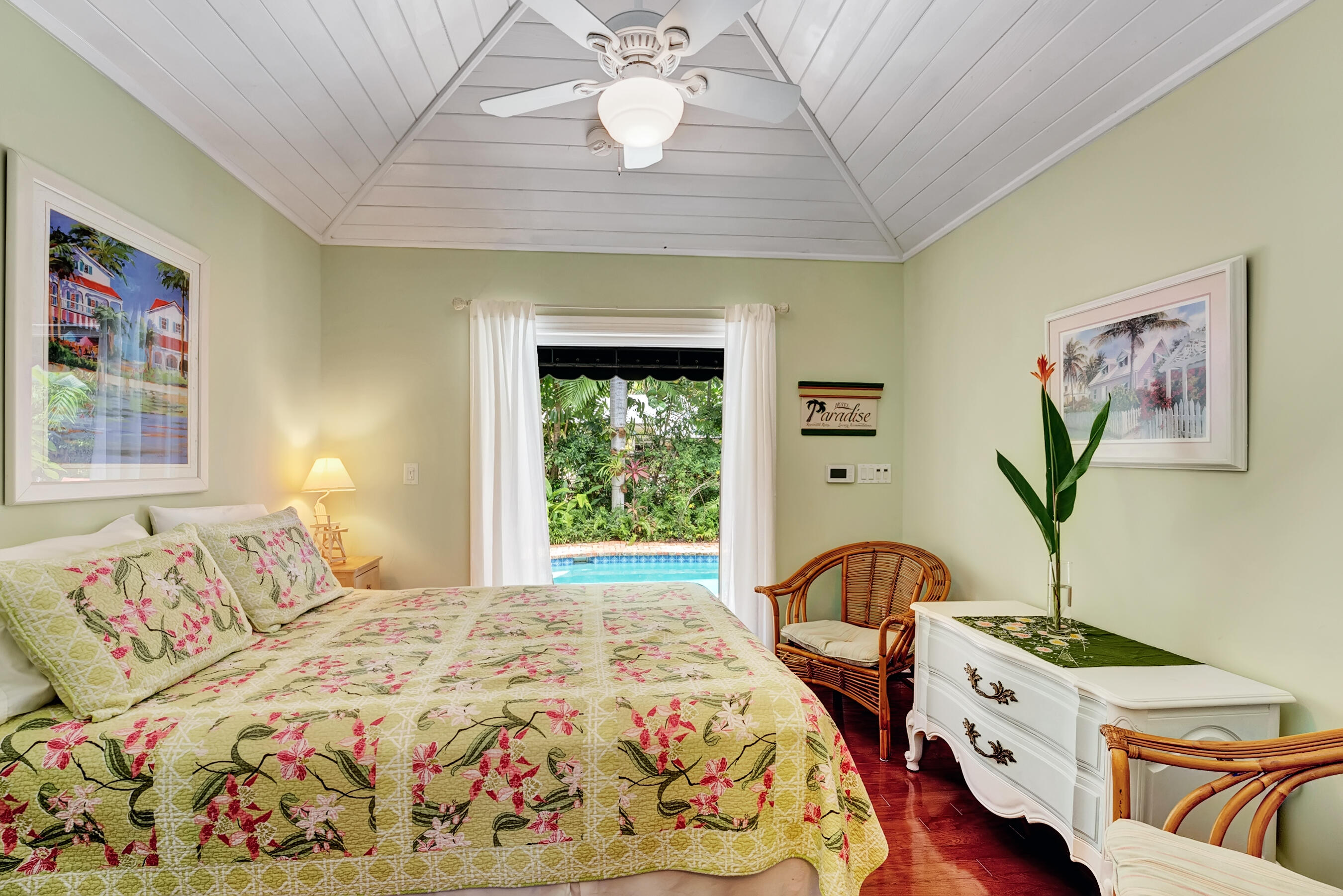 306 North Swinton Avenue Delray Beach, FL 33444 - Photo 14 of 53 a bedroom with a bed and a chandelier