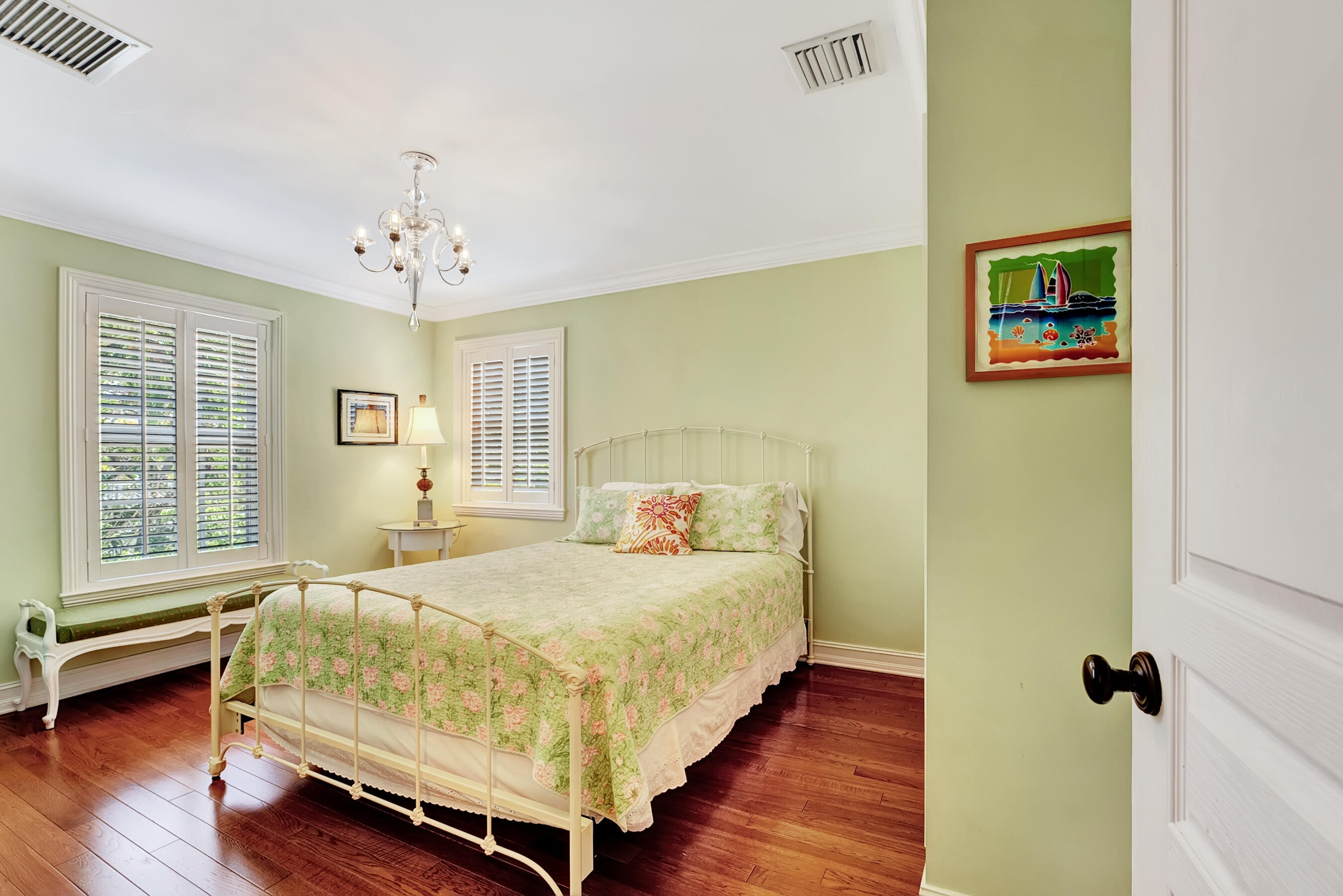 306 North Swinton Avenue Delray Beach, FL 33444 - Photo 24 of 53 a bedroom with a bed and a window