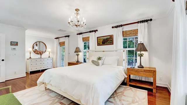 a bedroom with bed and a table