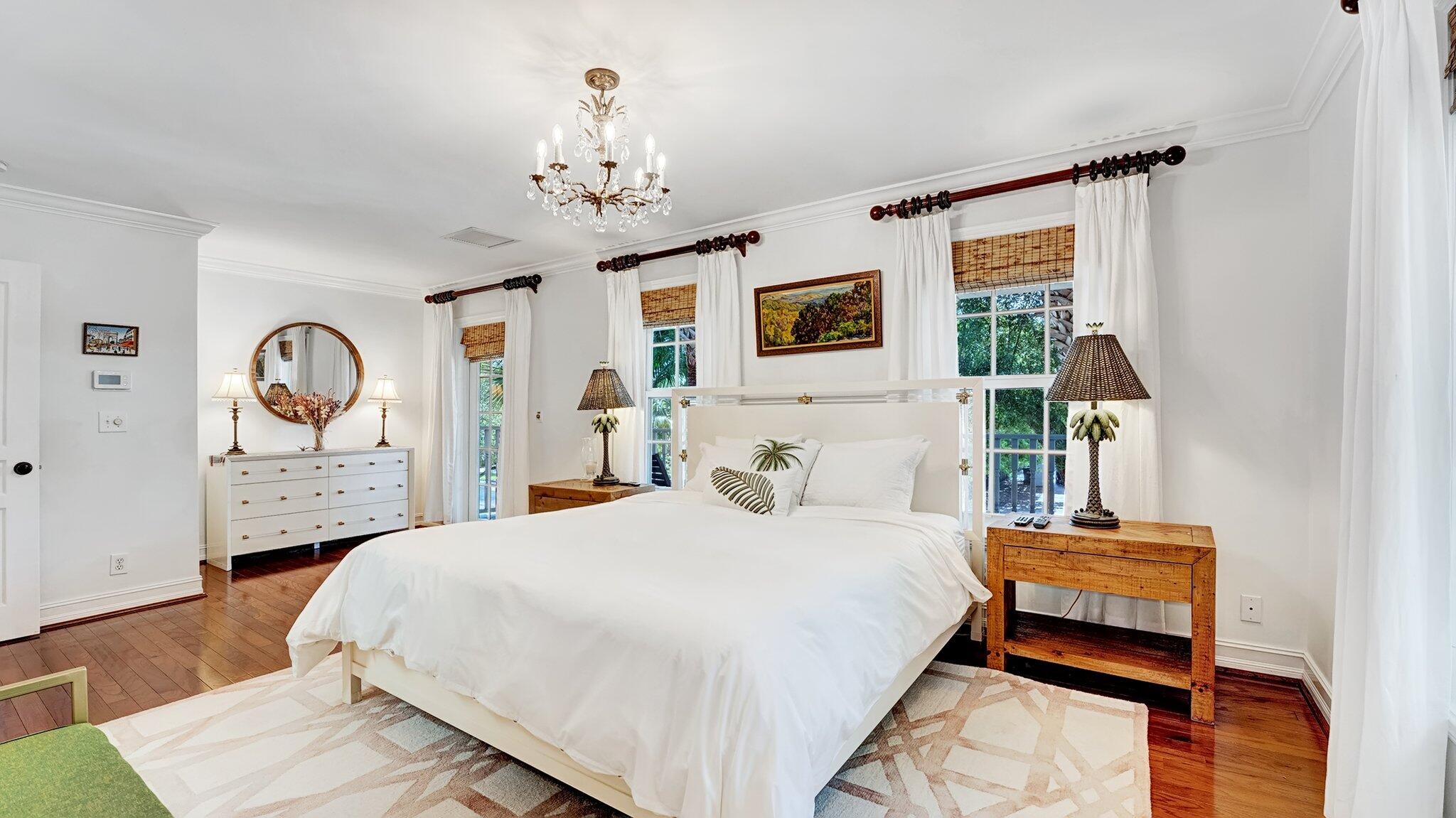 306 North Swinton Avenue Delray Beach, FL 33444 - Photo 25 of 53 a bedroom with a bed and a dresser with mirror